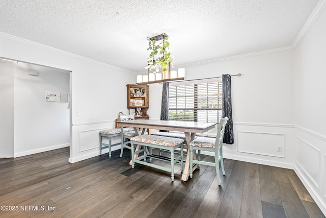 918 Arkenstone Dr, Jacksonville, FL 32225 - dining area featuring a textured ceiling, ornamental molding, dark wood-style floors, wainscoting, and a decorative wall