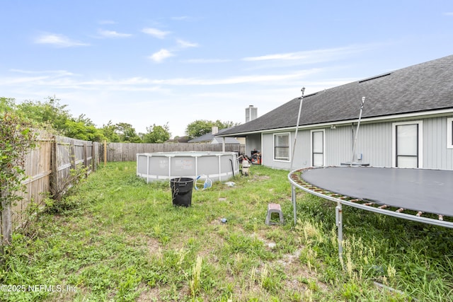 918 Arkenstone Dr, Jacksonville, FL 32225 - fenced backyard featuring a trampoline