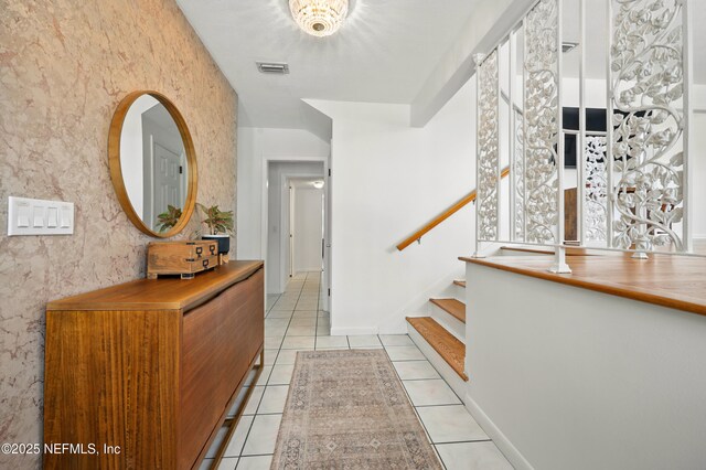 276 Baisden Rd, Jacksonville, FL 32218 - foyer featuring light tile patterned flooring and stairs