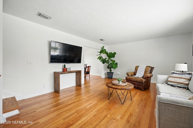 276 Baisden Rd, Jacksonville, FL 32218 - living room with light wood-style floors and baseboards