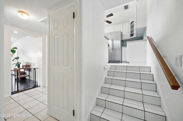276 Baisden Rd, Jacksonville, FL 32218 - staircase with tile patterned floors, baseboards, and ceiling fan