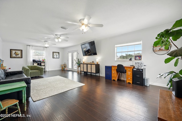 276 Baisden Rd, Jacksonville, FL 32218 - living room with ceiling fan, a desk, wood finished floors, and baseboards