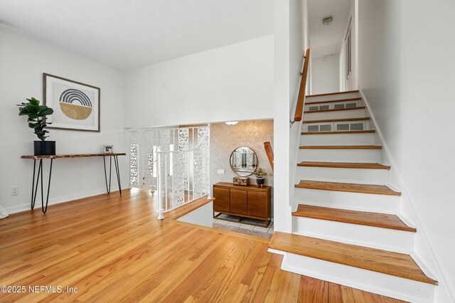 276 Baisden Rd, Jacksonville, FL 32218 - staircase featuring wood finished floors and baseboards