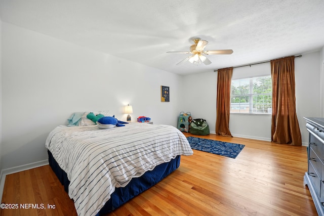 276 Baisden Rd, Jacksonville, FL 32218 - bedroom featuring light wood-style floors, baseboards, and a ceiling fan