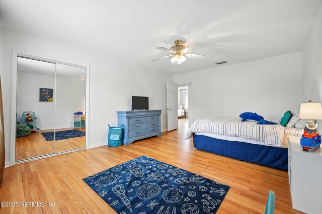 276 Baisden Rd, Jacksonville, FL 32218 - bedroom featuring wood finished floors, ceiling fan, baseboards, and a closet