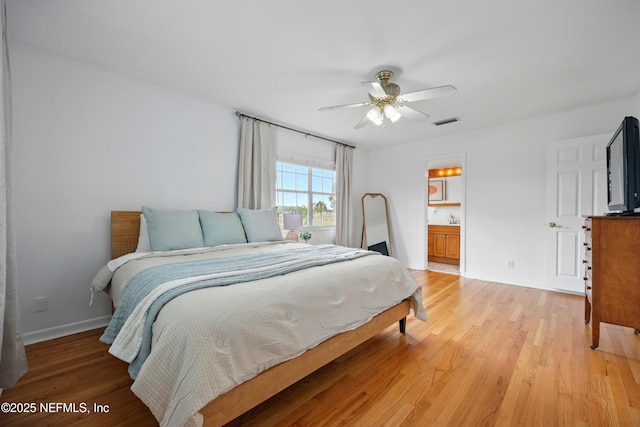 276 Baisden Rd, Jacksonville, FL 32218 - bedroom with light wood finished floors, baseboards, and a ceiling fan