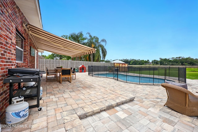 276 Baisden Rd, Jacksonville, FL 32218 - view of swimming pool featuring outdoor dining space, a patio, and a fenced backyard