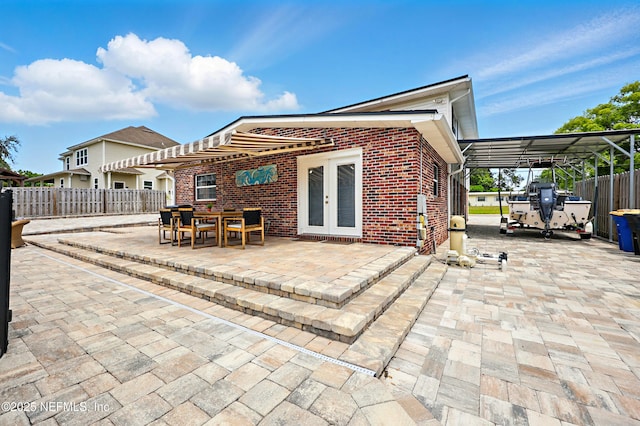 276 Baisden Rd, Jacksonville, FL 32218 - back of house with brick siding, french doors, and outdoor dining area