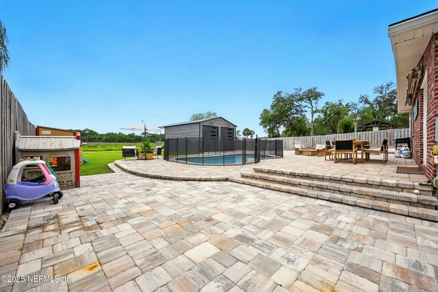 276 Baisden Rd, Jacksonville, FL 32218 - view of pool featuring a patio, an outdoor hangout area, and a fenced backyard