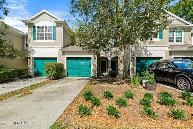 7990 Baymeadows Rd E Unit 2006, Jacksonville, FL 32256 - multi unit property featuring stucco siding, driveway, and a garage