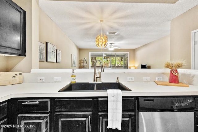 7990 Baymeadows Rd E Unit 2006, Jacksonville, FL 32256 - kitchen featuring dishwasher, dark cabinets, a sink, and light countertops