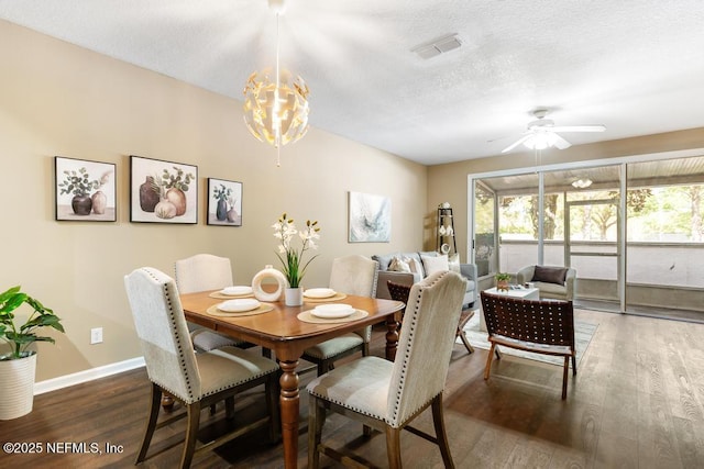 7990 Baymeadows Rd E Unit 2006, Jacksonville, FL 32256 - dining area with wood finished floors, ceiling fan, baseboards, a textured ceiling, and a chandelier