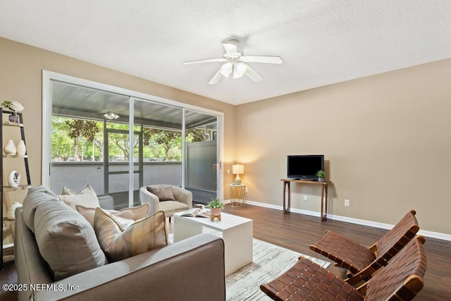 7990 Baymeadows Rd E Unit 2006, Jacksonville, FL 32256 - living room with a ceiling fan, baseboards, and wood finished floors