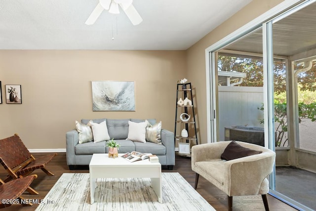 7990 Baymeadows Rd E Unit 2006, Jacksonville, FL 32256 - living area with ceiling fan, dark wood-type flooring, and baseboards