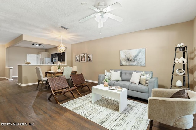 7990 Baymeadows Rd E Unit 2006, Jacksonville, FL 32256 - living area with dark wood finished floors, baseboards, ceiling fan, and a textured ceiling
