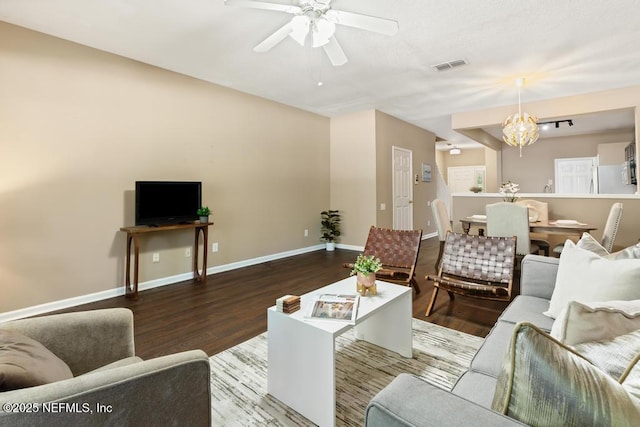 7990 Baymeadows Rd E Unit 2006, Jacksonville, FL 32256 - living area featuring wood finished floors, a ceiling fan, a chandelier, and baseboards