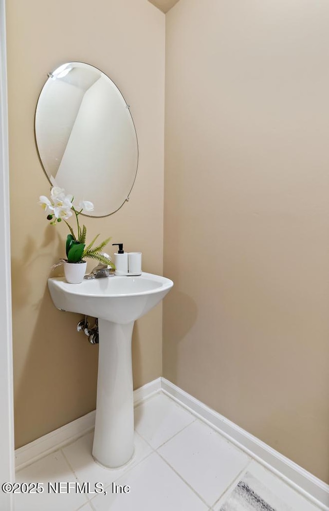 7990 Baymeadows Rd E Unit 2006, Jacksonville, FL 32256 - bathroom with baseboards, tile patterned flooring, and a sink