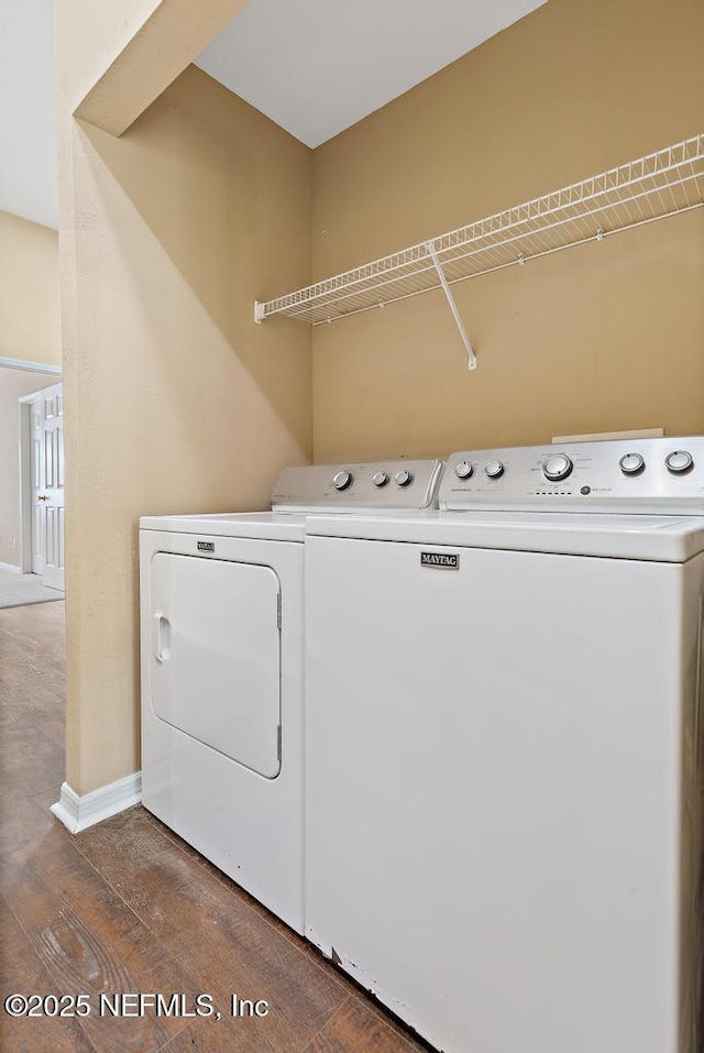 7990 Baymeadows Rd E Unit 2006, Jacksonville, FL 32256 - laundry room with washer and clothes dryer, dark wood-style floors, and baseboards