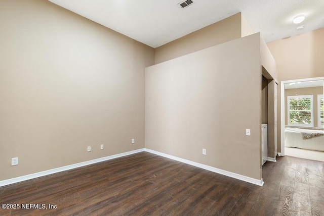 7990 Baymeadows Rd E Unit 2006, Jacksonville, FL 32256 - empty room with dark wood-type flooring and baseboards