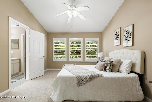 7990 Baymeadows Rd E Unit 2006, Jacksonville, FL 32256 - carpeted bedroom featuring lofted ceiling, baseboards, ensuite bath, and ceiling fan