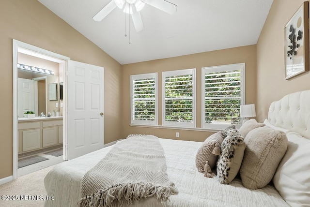 7990 Baymeadows Rd E Unit 2006, Jacksonville, FL 32256 - carpeted bedroom featuring vaulted ceiling, multiple windows, ensuite bathroom, and ceiling fan