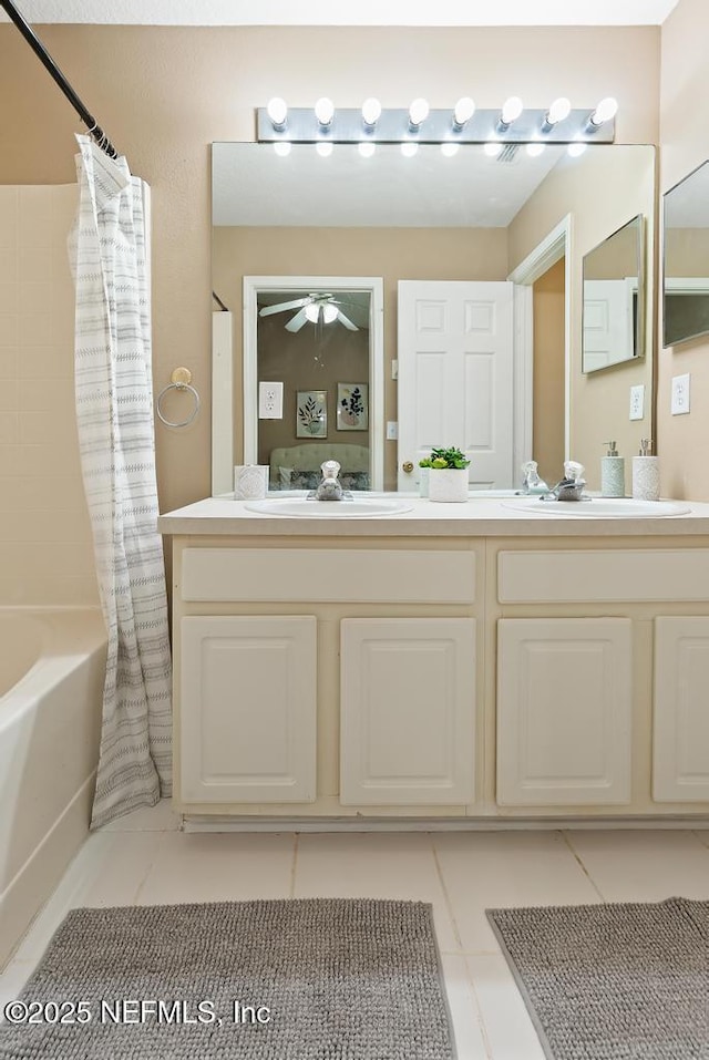 7990 Baymeadows Rd E Unit 2006, Jacksonville, FL 32256 - full bathroom with double vanity, tile patterned flooring, shower / tub combo with curtain, and a ceiling fan