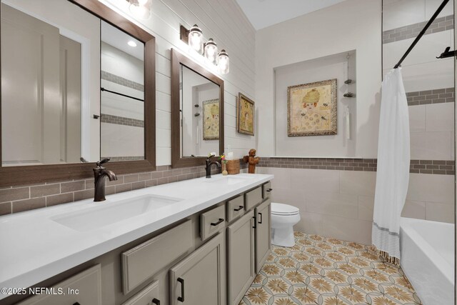 71 Deer Ridge Dr, Ponte Vedra, FL 32081 - full bathroom with tile walls, double vanity, toilet, shower / tub combo, and tile patterned flooring