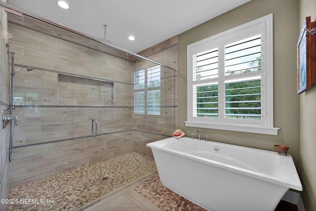 71 Deer Ridge Dr, Ponte Vedra, FL 32081 - full bathroom featuring a soaking tub, a stall shower, and recessed lighting