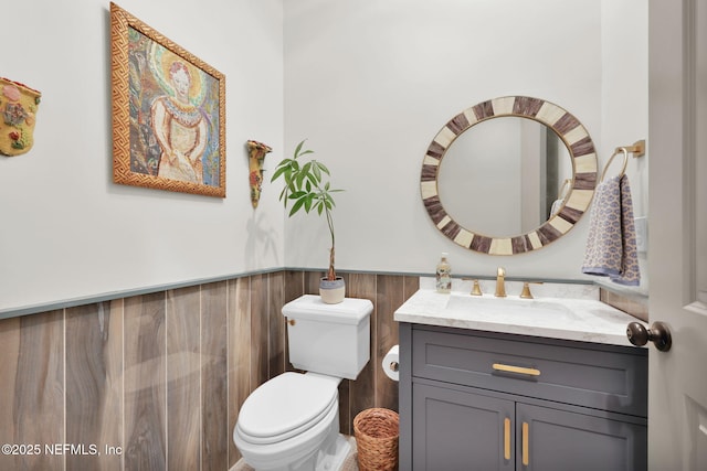 71 Deer Ridge Dr, Ponte Vedra, FL 32081 - half bath featuring wainscoting, vanity, and toilet