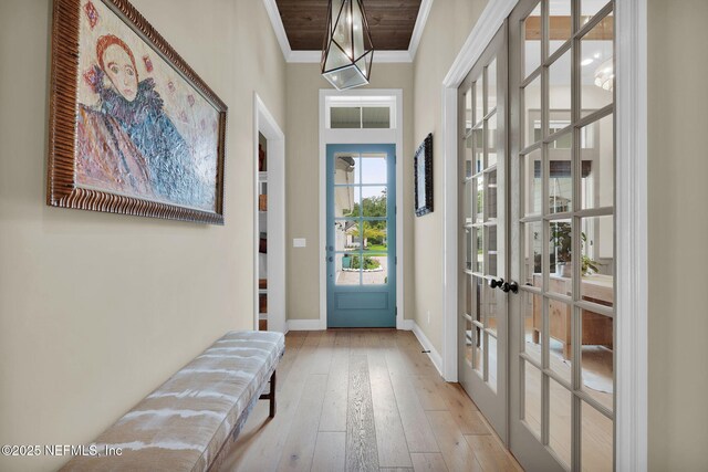 71 Deer Ridge Dr, Ponte Vedra, FL 32081 - entryway featuring ornamental molding, french doors, baseboards, and wood-type flooring