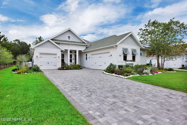 71 Deer Ridge Dr, Ponte Vedra, FL 32081 - view of front of home with a garage, a front yard, and decorative driveway