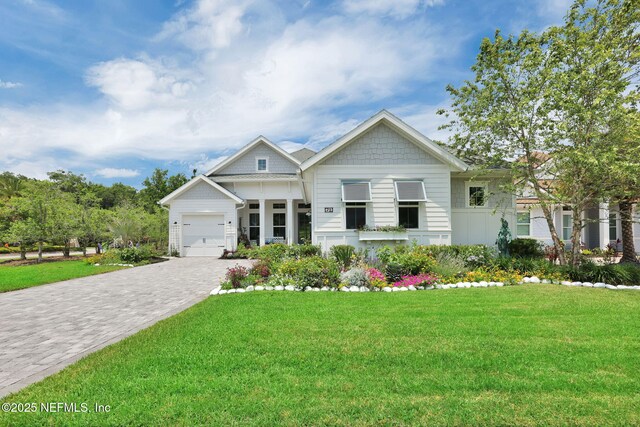 71 Deer Ridge Dr, Ponte Vedra, FL 32081 - view of front of property with a front yard, decorative driveway, and an attached garage