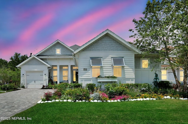 71 Deer Ridge Dr, Ponte Vedra, FL 32081 - view of front of house featuring decorative driveway, a lawn, and a garage