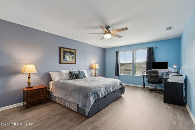 2309 Shady Breeze Ln, Green Cove Springs, FL 32043 - bedroom featuring baseboards, wood finished floors, an office area, and a ceiling fan