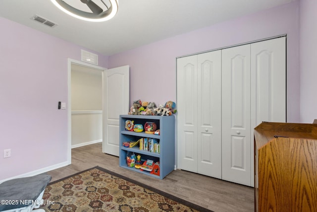 2309 Shady Breeze Ln, Green Cove Springs, FL 32043 - game room featuring wood finished floors and baseboards