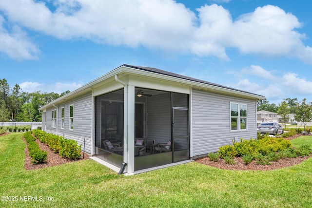 95 Elm Creek Dr, Saint Augustine, FL 32092 - view of property exterior featuring a sunroom and a yard