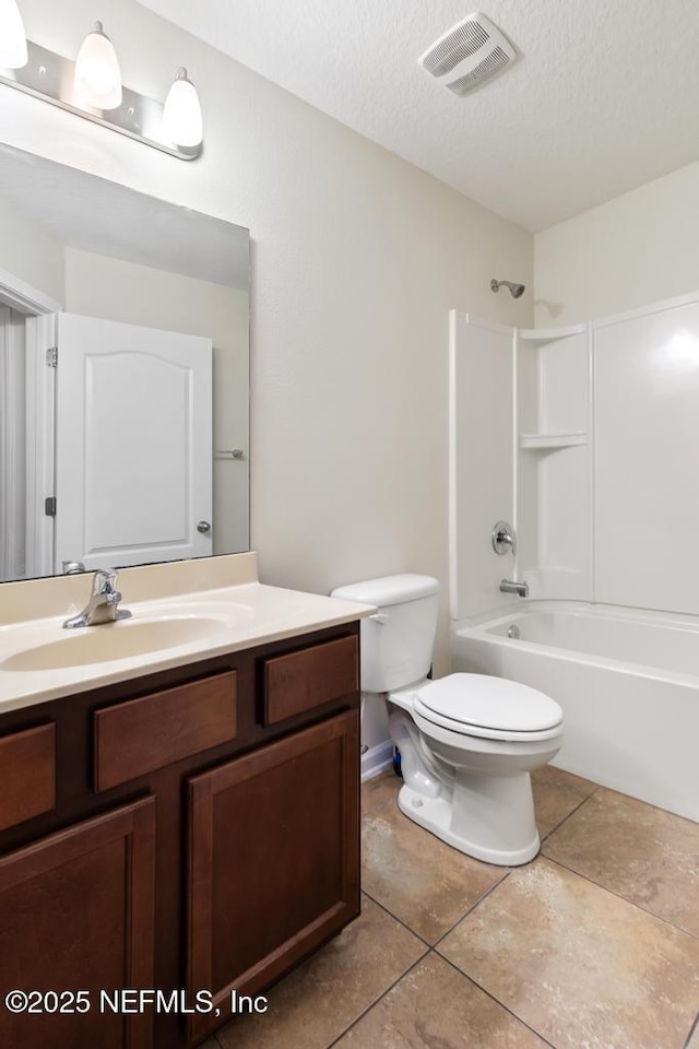 112 Glenlivet Way, Saint Johns, FL 32259 - full bathroom with vanity, tub / shower combination, tile patterned floors, and a textured ceiling