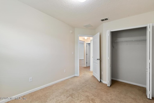 112 Glenlivet Way, Saint Johns, FL 32259 - unfurnished bedroom featuring carpet flooring, a textured ceiling, and a closet