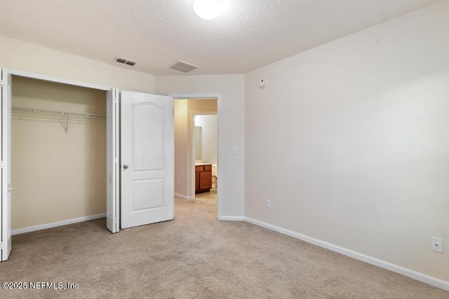 112 Glenlivet Way, Saint Johns, FL 32259 - unfurnished bedroom featuring light carpet, a textured ceiling, and a closet