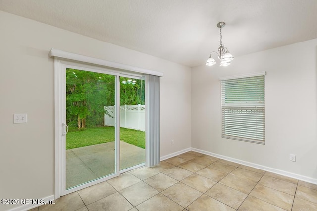 112 Glenlivet Way, Saint Johns, FL 32259 - empty room featuring a chandelier and light tile patterned floors