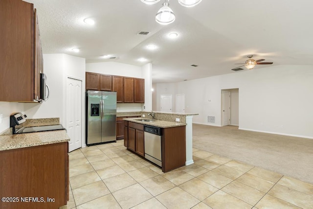 112 Glenlivet Way, Saint Johns, FL 32259 - kitchen with stainless steel appliances, lofted ceiling, open floor plan, ceiling fan, and light carpet