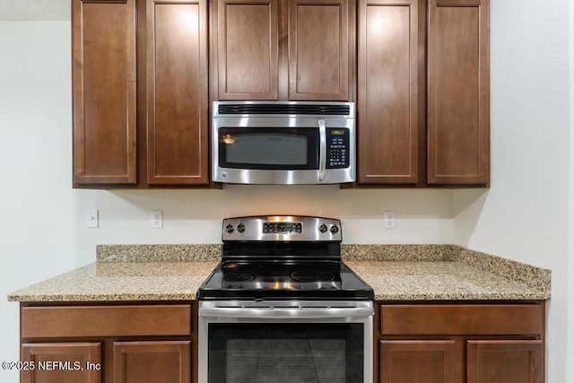 112 Glenlivet Way, Saint Johns, FL 32259 - kitchen featuring appliances with stainless steel finishes and light stone counters