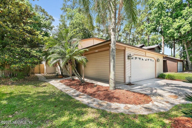 5524 Manfields Pl, Jacksonville, FL 32207 - view of side of home with a garage and driveway