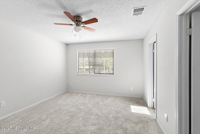 5524 Manfields Pl, Jacksonville, FL 32207 - carpeted spare room with ceiling fan, a textured ceiling, and baseboards