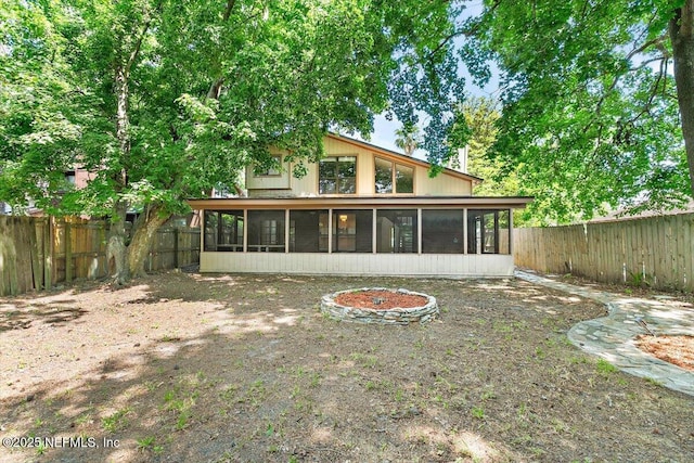 5524 Manfields Pl, Jacksonville, FL 32207 - back of house with a sunroom and a fenced backyard