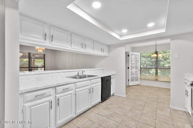 5524 Manfields Pl, Jacksonville, FL 32207 - kitchen with black dishwasher, a sink, a chandelier, white cabinetry, and a raised ceiling