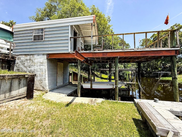 104 Waterway Ave, Satsuma, FL 32189 - rear view of house featuring a yard and a deck with water view