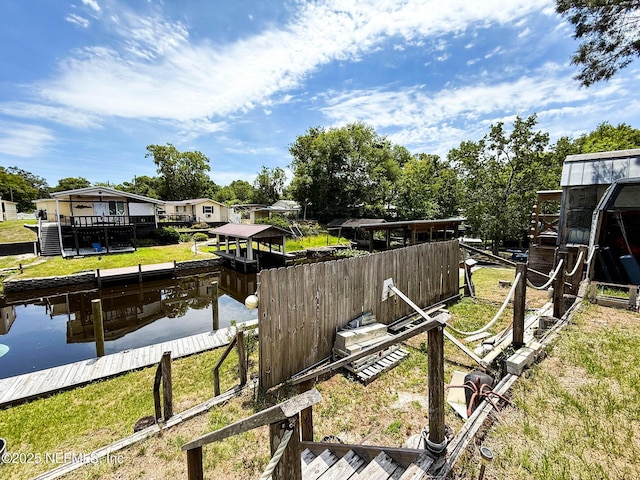 104 Waterway Ave, Satsuma, FL 32189 - view of grassy yard featuring a water view and a boat dock