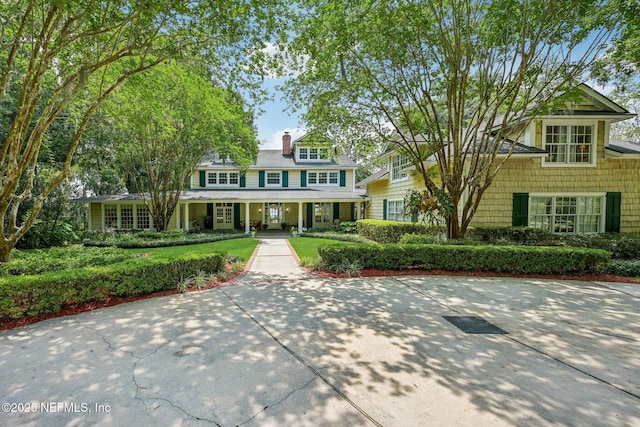 145 River Rd, Orange Park, FL 32073 - shingle-style home with covered porch and a chimney
