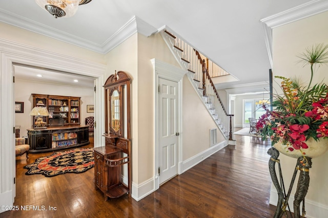 145 River Rd, Orange Park, FL 32073 - entryway featuring stairway, wood finished floors, crown molding, and baseboards